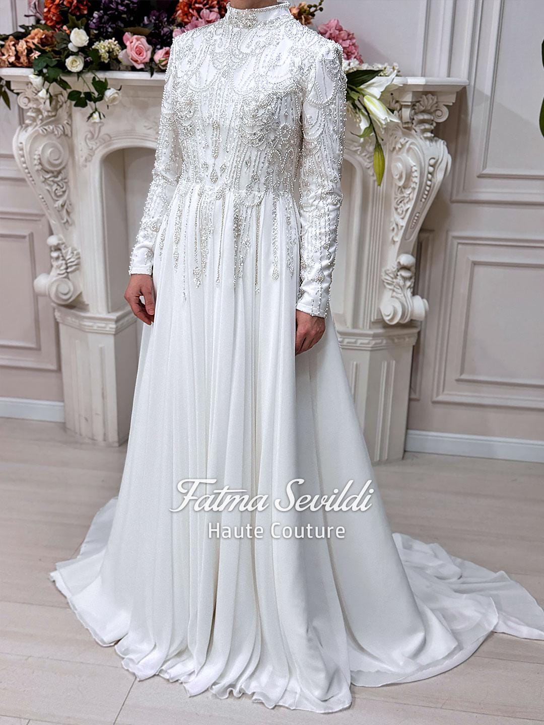 Elegant white satin Muslim wedding dress with beaded long sleeves and cape