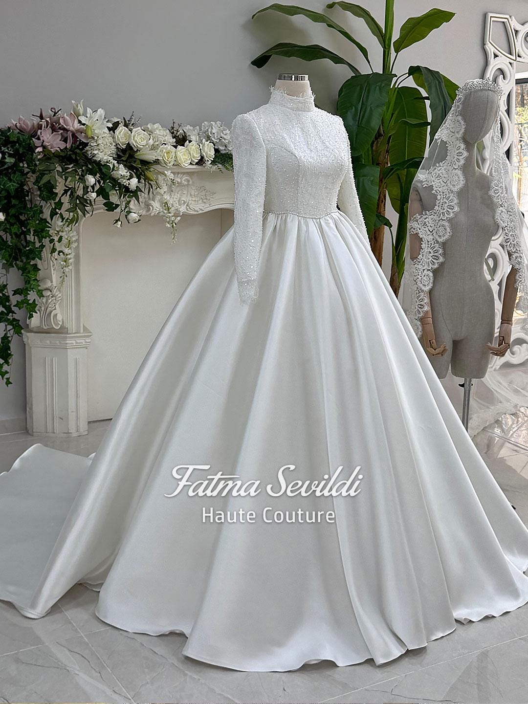 Elegant veiled hijab wedding dress with high neck, long sleeves, beaded lace bodice