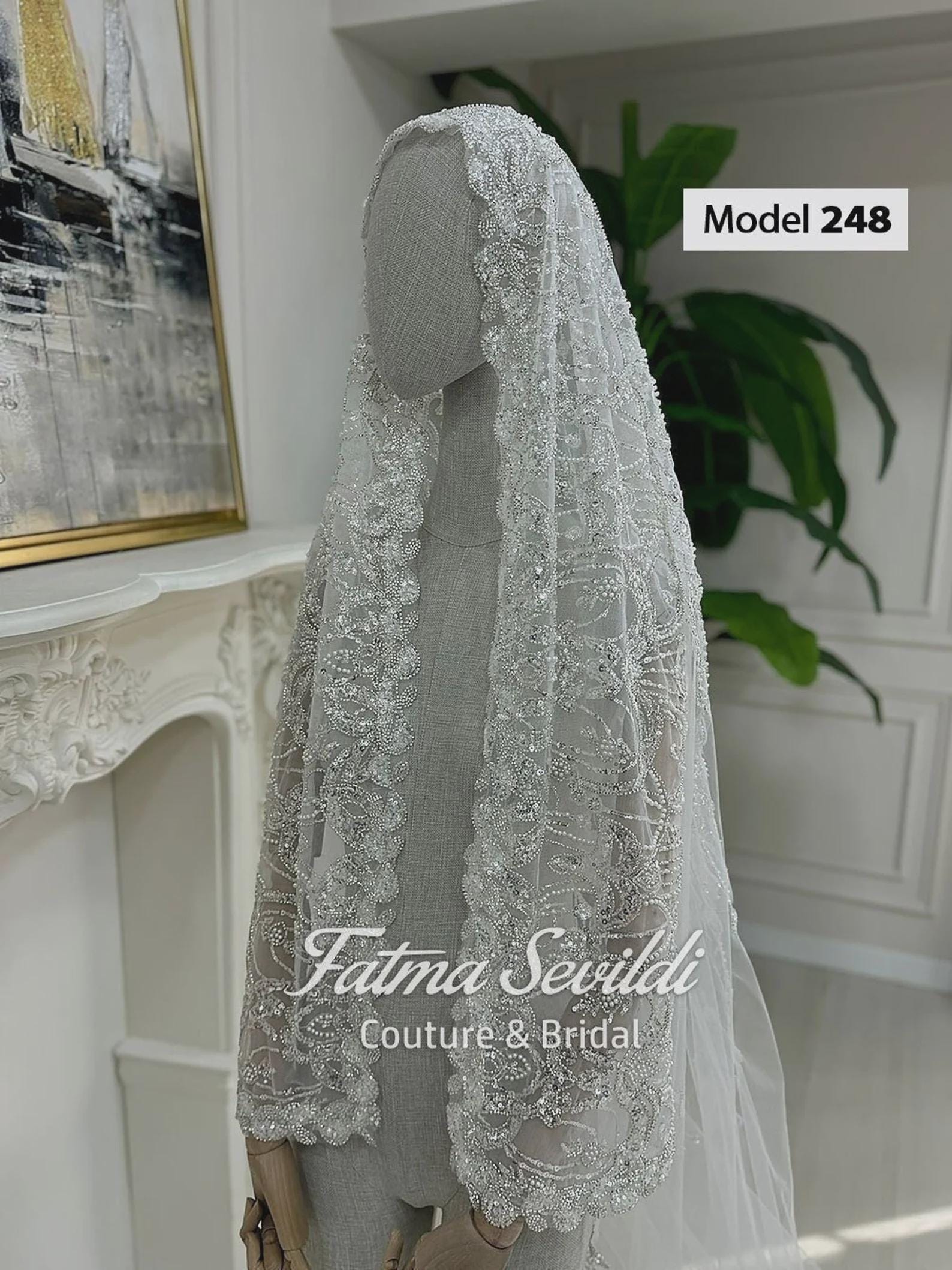 Delicate sheer white lace cathedral bridal veil with silver beading