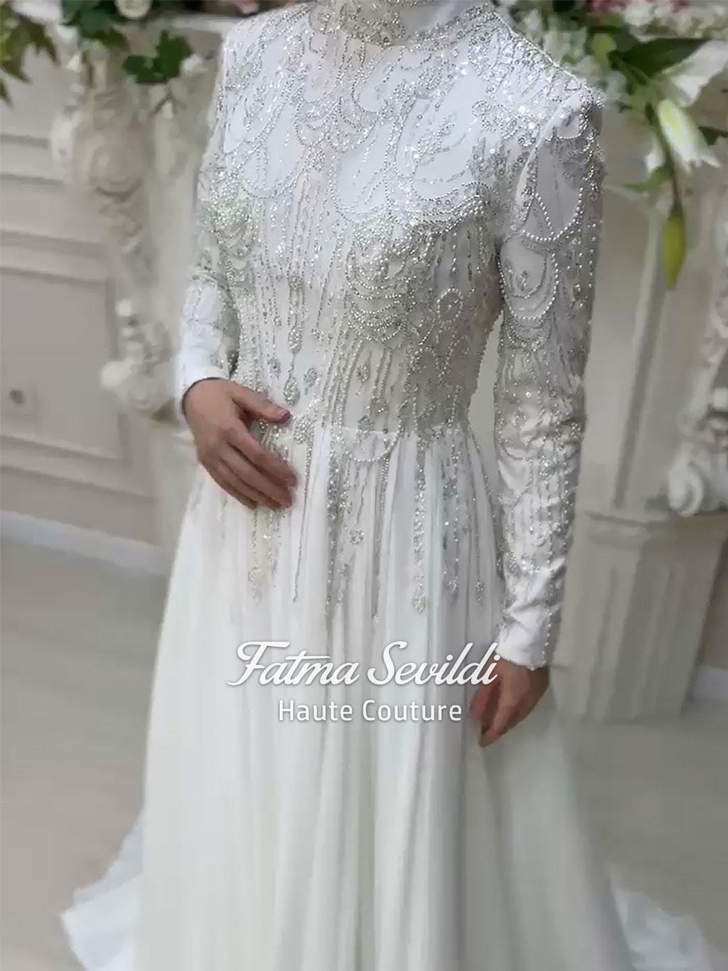Veiled Muslim wedding dress by Fatma Sevildi with beaded lace sleeves