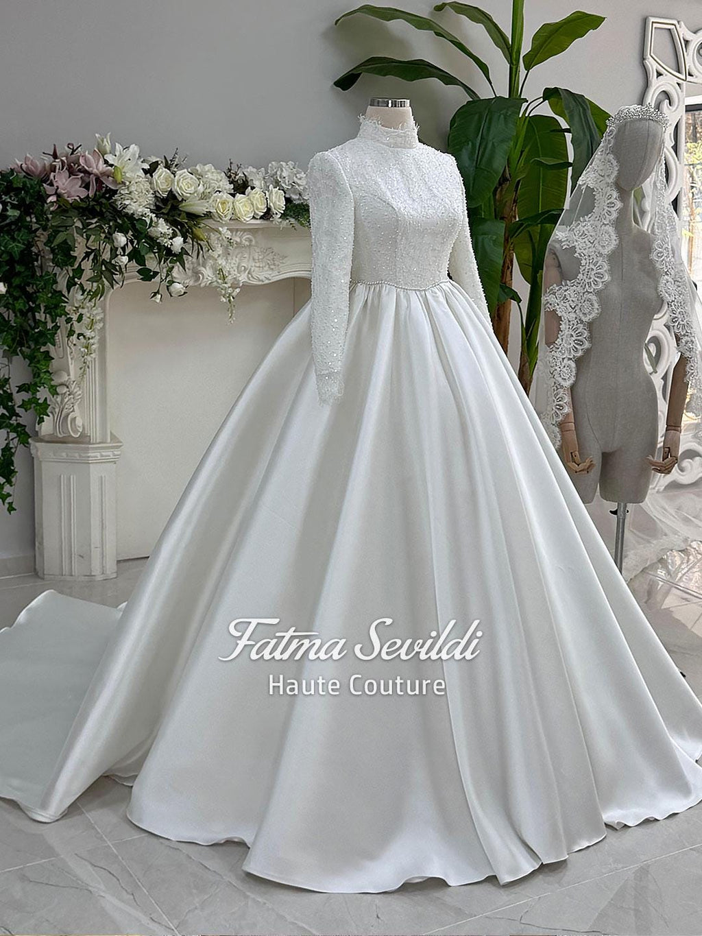 Elegant veiled hijab wedding gown in white beaded lace satin with high neck and long sleeves