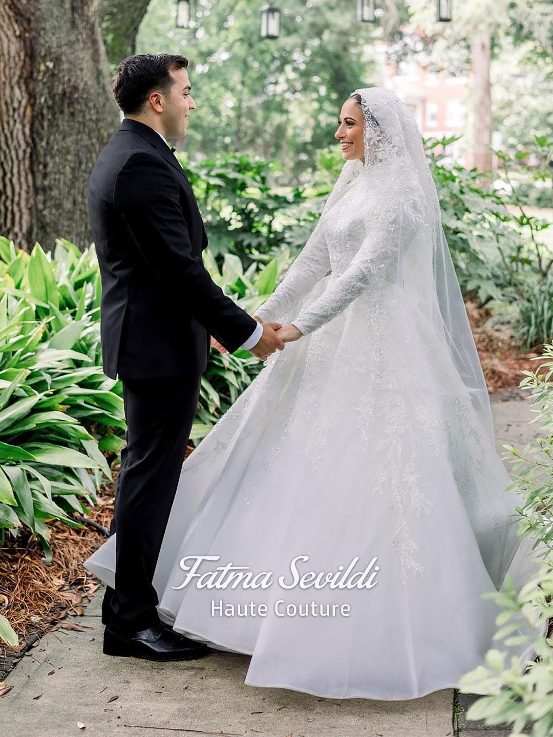 Elegant ivory veiled hijab wedding gown with beaded lace sleeves