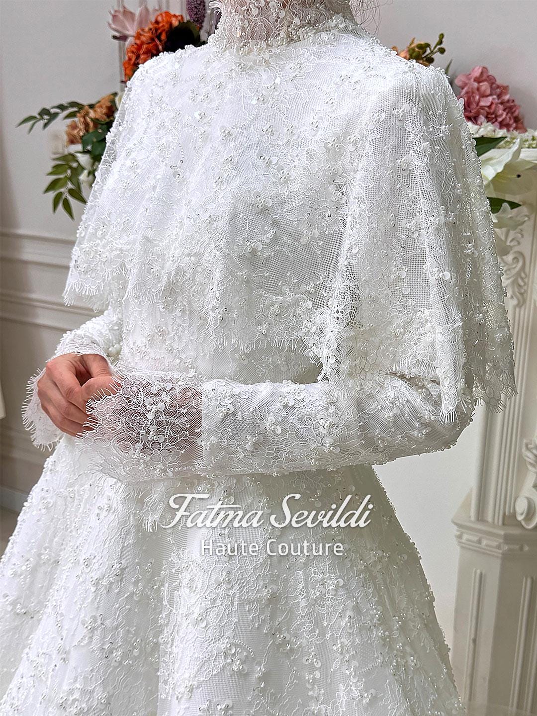 Elegant veiled hijab wedding dress with beaded lace cape, high neck, long sleeve A-line gown