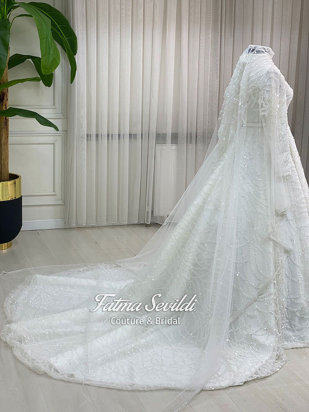 Elegant veiled Muslim bridal veil with lace and beads on mannequin