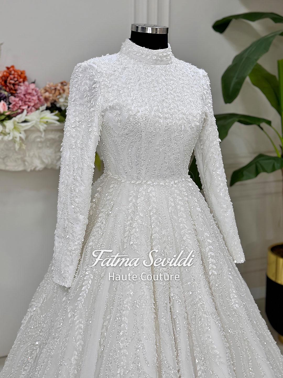 White beaded lace hijab wedding dress with high neck long sleeves