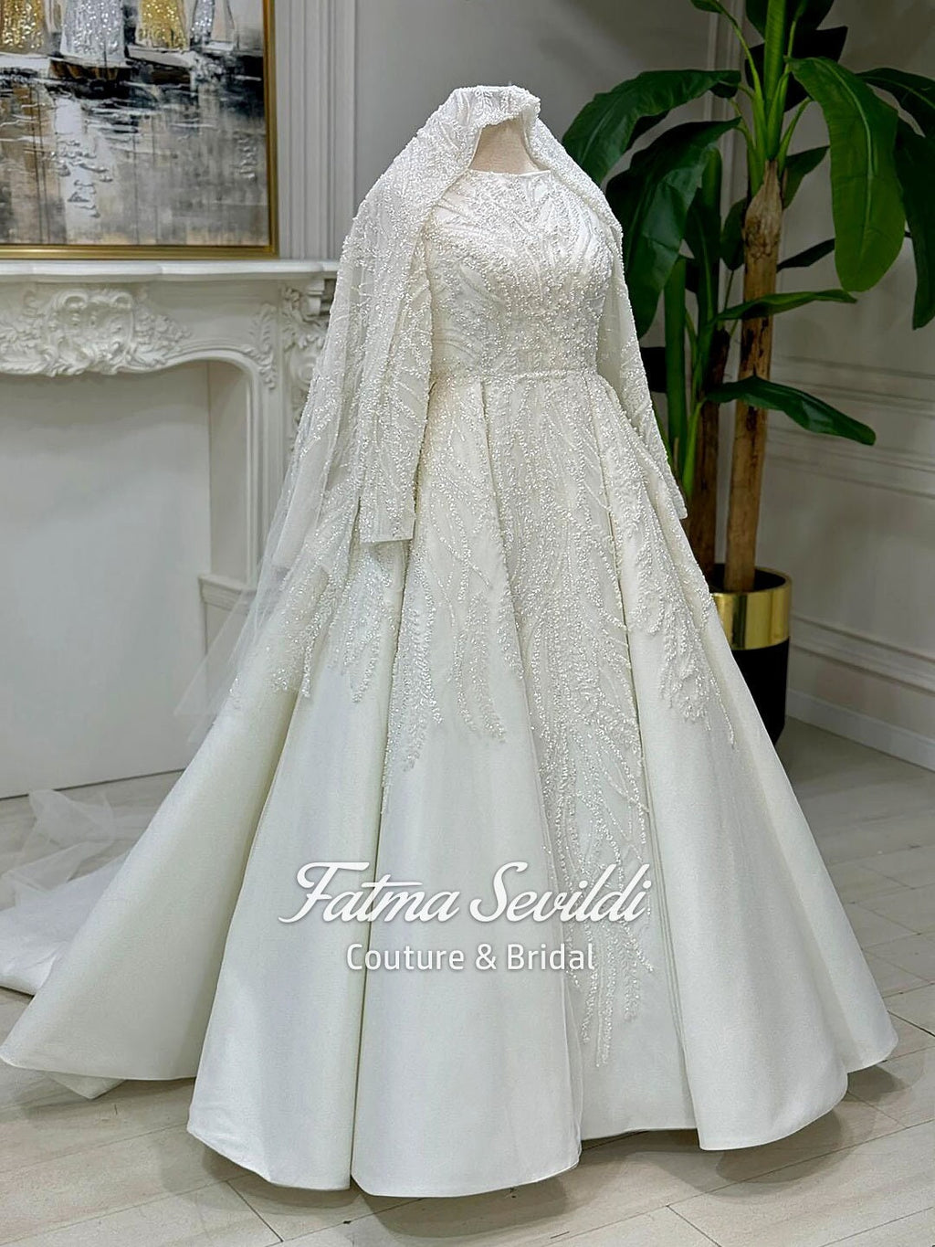 Beaded lace Muslim wedding dress with embroidered veil on mannequin