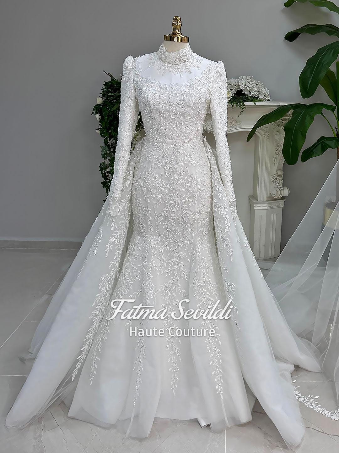 White long-sleeved mermaid hijab wedding dress with lace and detachable overskirt