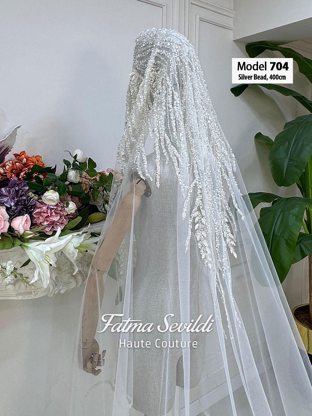 Delicate white PART13 cathedral bridal veil with lace edge, silver beads, tassels