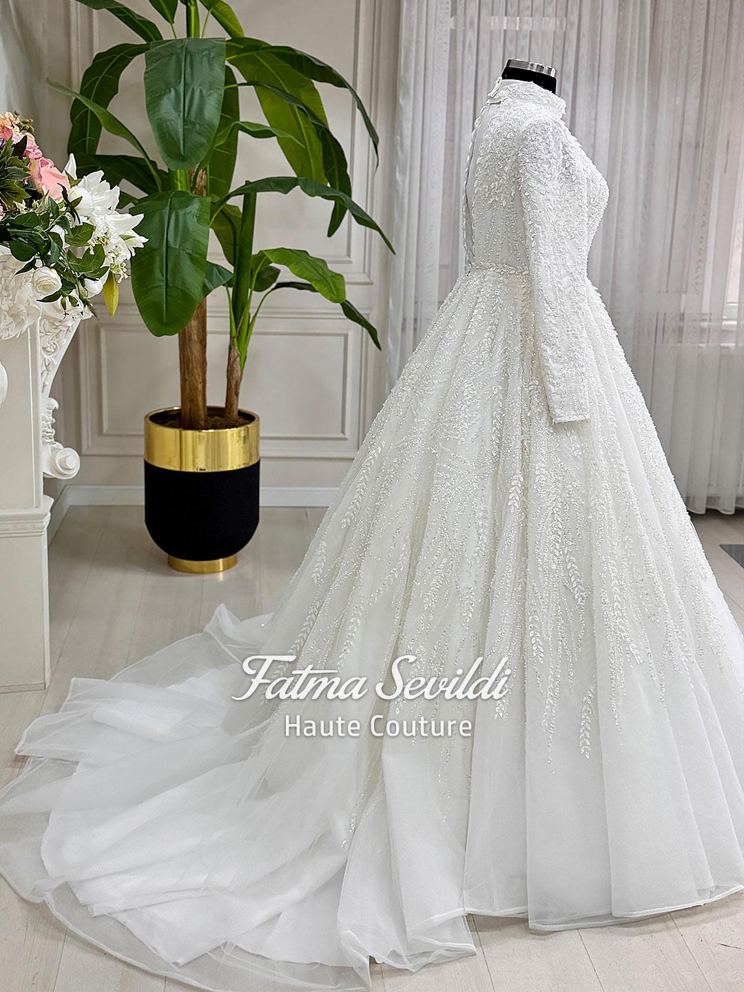 White beaded lace hijab wedding dress with high neck and long sleeves