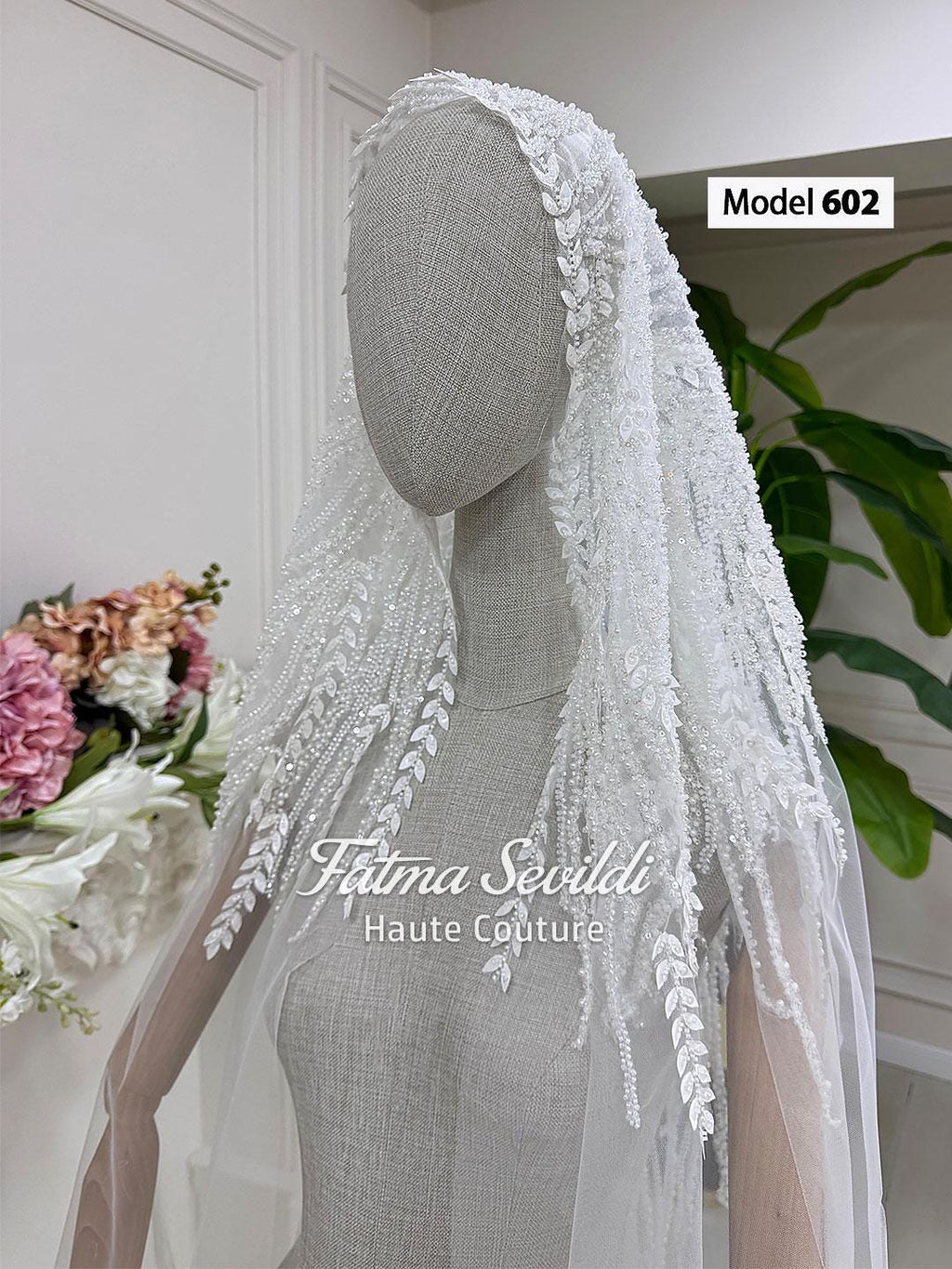 White lace bridal veil with leaf embroidery and beaded details by Fatma Sevildi