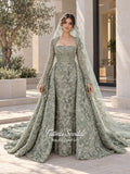 Sage green evening dress with beaded floral lace, a sweetheart neckline and long sleeves with flared lace cuffs, displayed on a mannequin.
