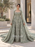 Sage green evening dress with beaded floral lace, a sweetheart neckline and long sleeves with flared lace cuffs, displayed on a mannequin.