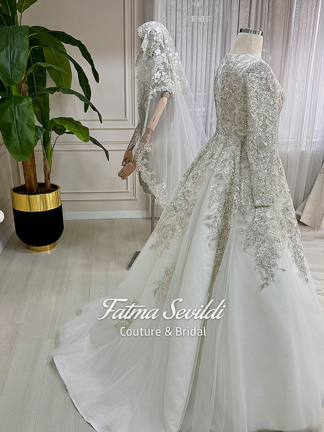 Shimmering white modest Muslim wedding dress with 3D beaded lace