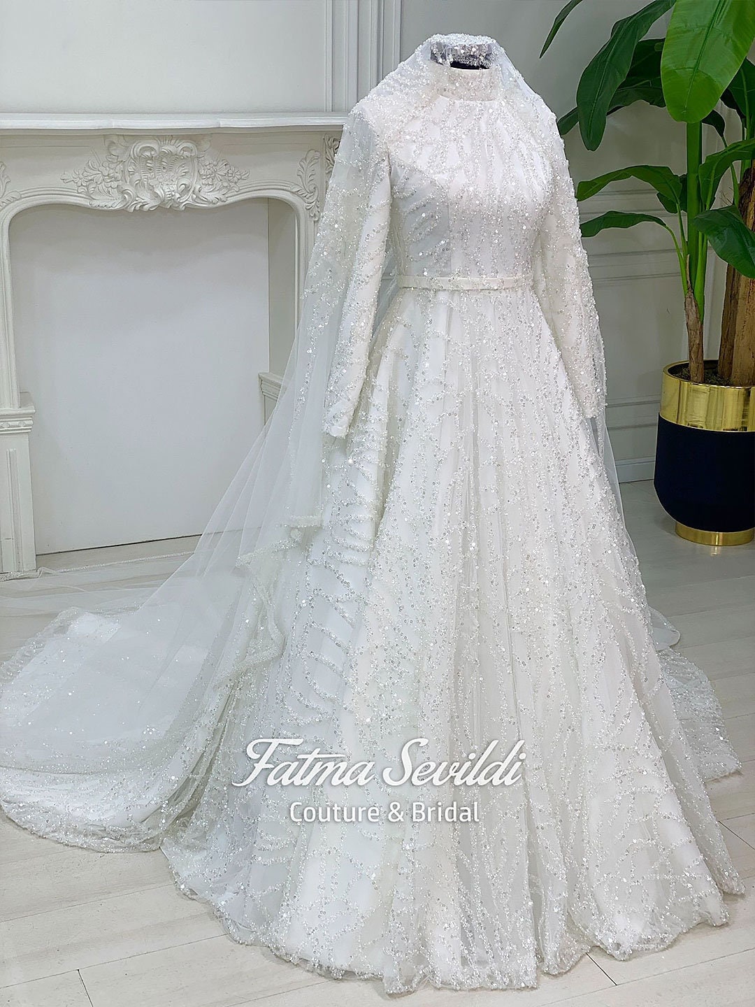 Elegant veiled Muslim wedding dress with full beaded lace ball gown