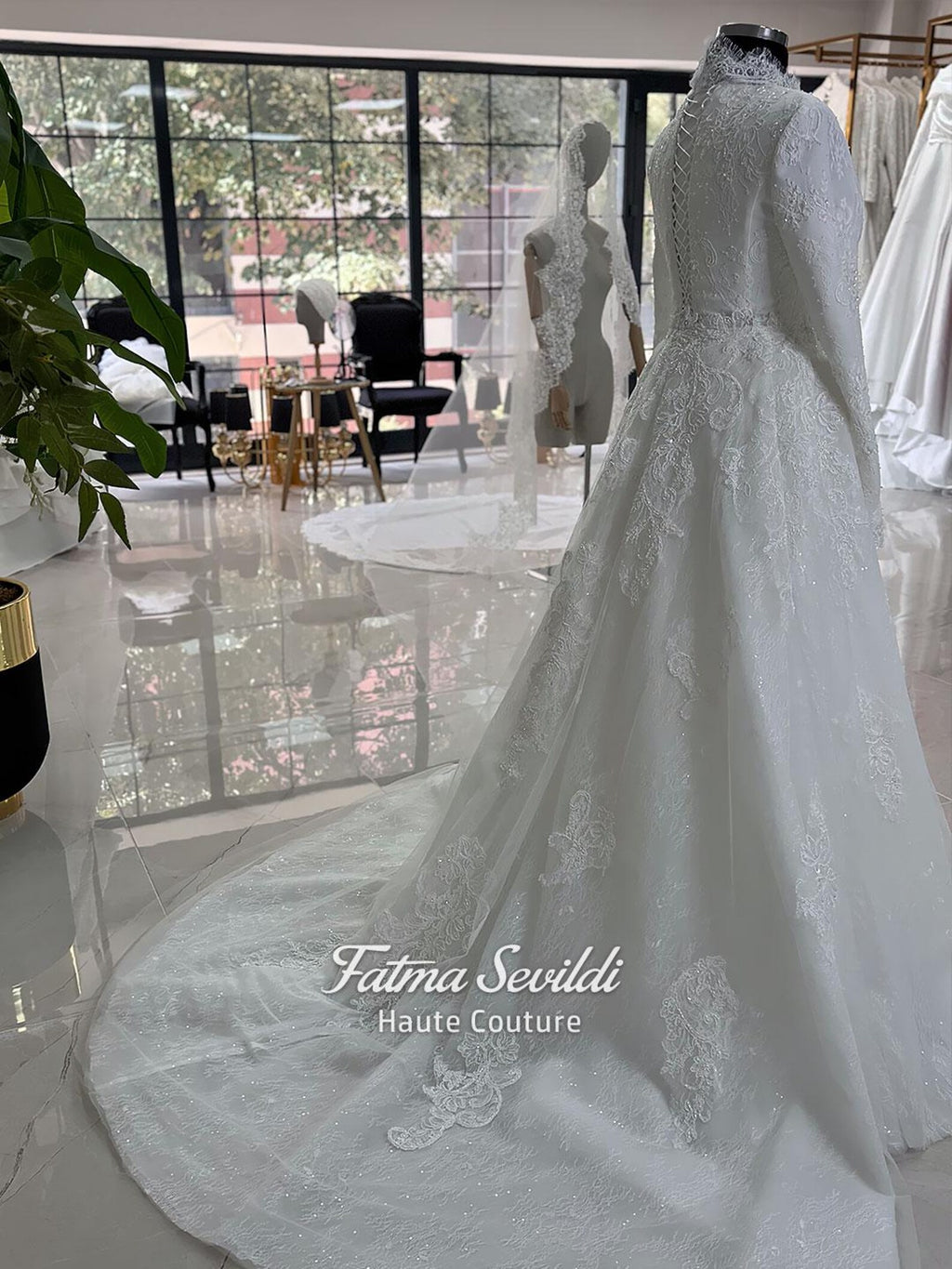 White hijab wedding dress with long sleeves, floral lace, high neckline and detachable overskirt, styled with a premium lace veil. Luxury modest bridal gown designed for a fully covered Muslim bridal look.
